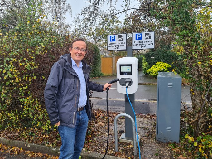 Cllr Martin Tod and an electric vehicle charging point